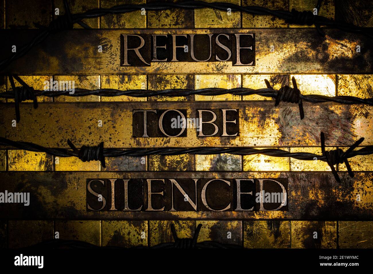Refuse to be Silenced text on vintaged textured copper and gold background Stock Photo