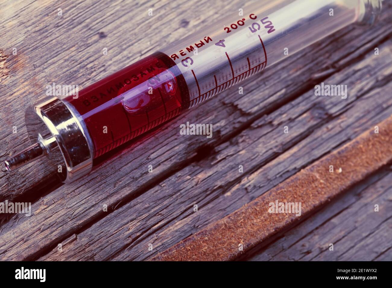 Old glass syringe on the grunge wooden surface Stock Photo Alamy
