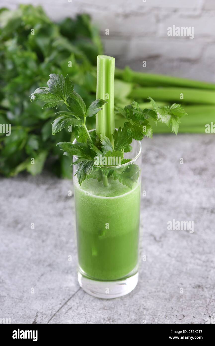 A glass of freshly made celery smoothie. A detox drink for those who care about health. Stock Photo
