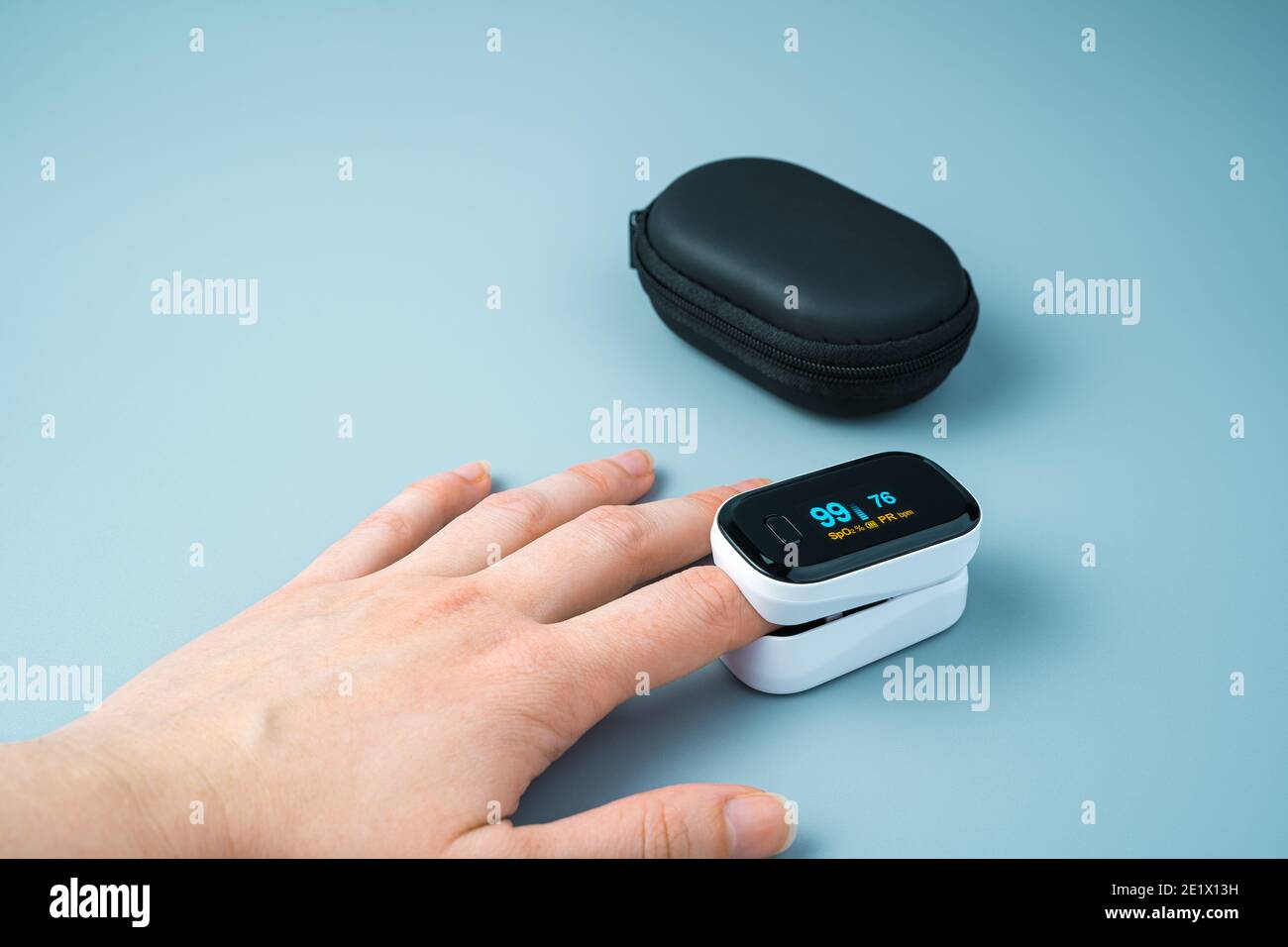 Measuring the oxygen level on a person's arm. Side view Stock Photo Alamy