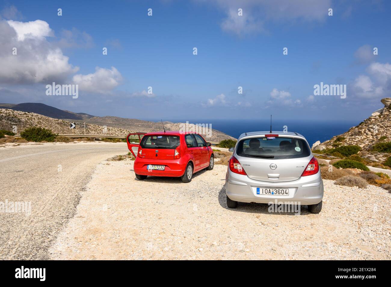 Ios, Greece - September 21, 2020: Opel Corsa and Seat Mii on the road in the east part of Ios Island. Cyclades, Greece Stock Photo
