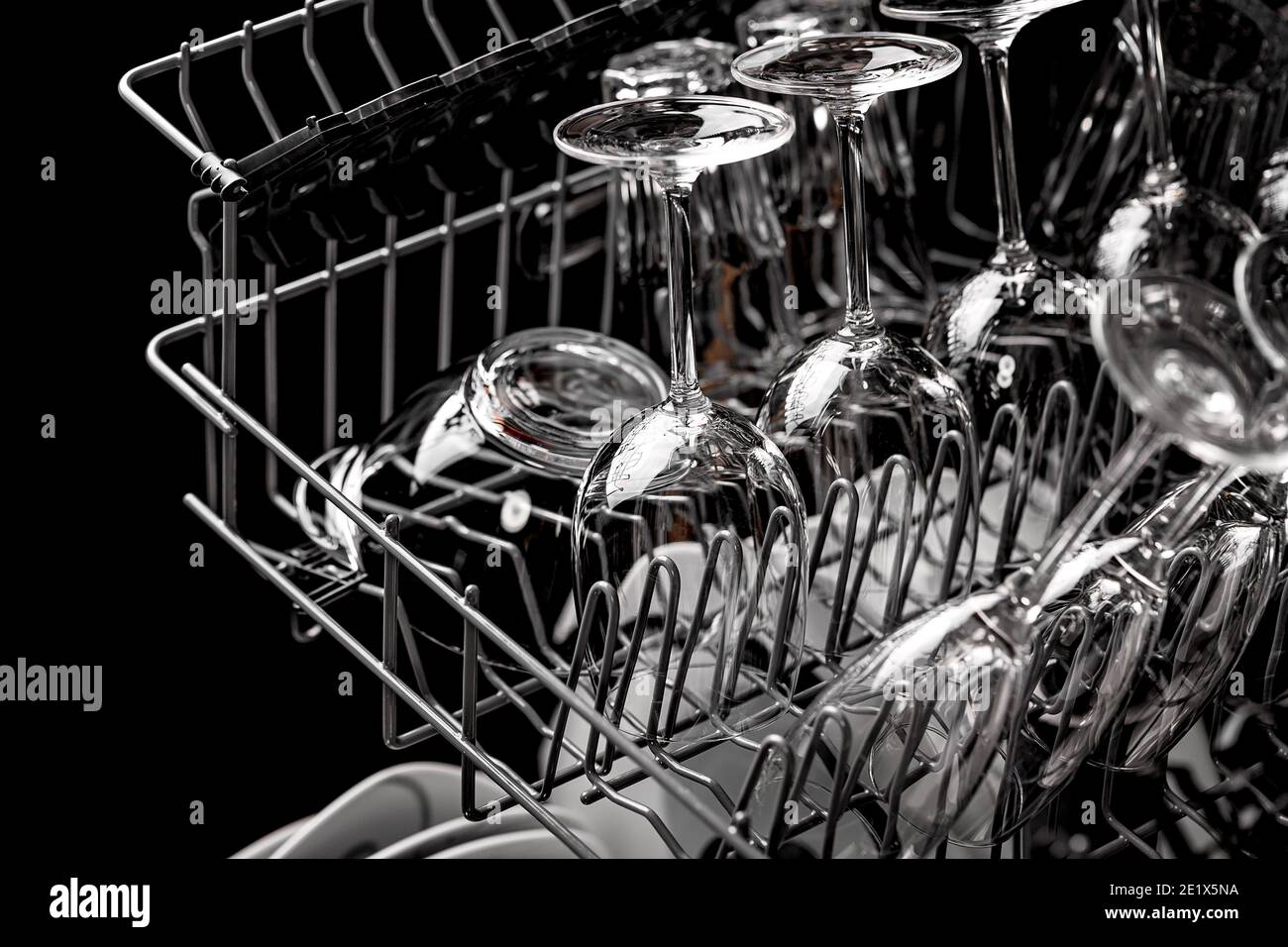 Clean dishes in the dishwasher. Wine glasses, sparkling wine glasses