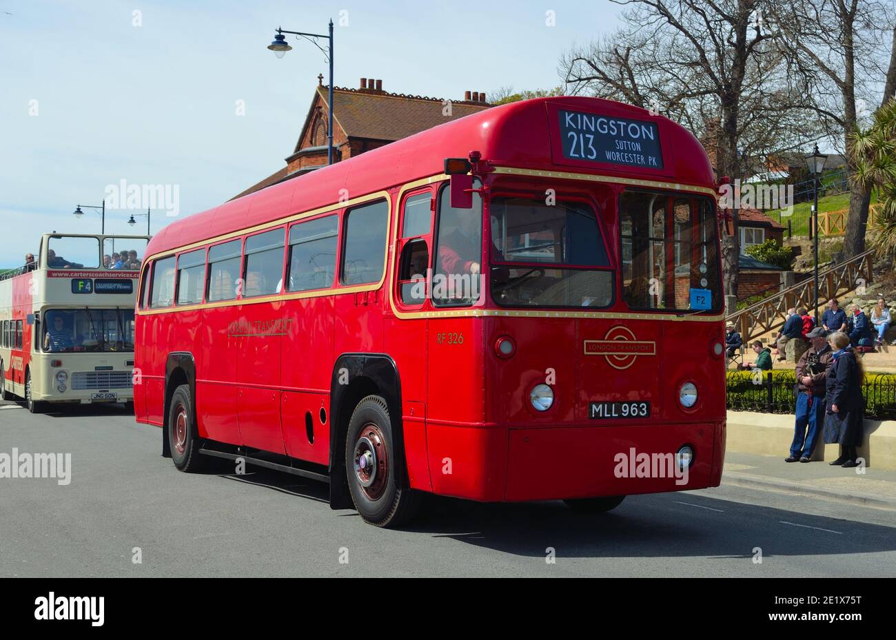 Classic Red London Transport Bus being driven on the road. Stock Photo