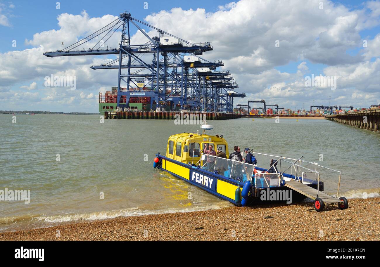Harwich to Felixstowe and Shotley ferry takes up to twelve people across the busy estuary, port of Felixstowe in background Stock Photo