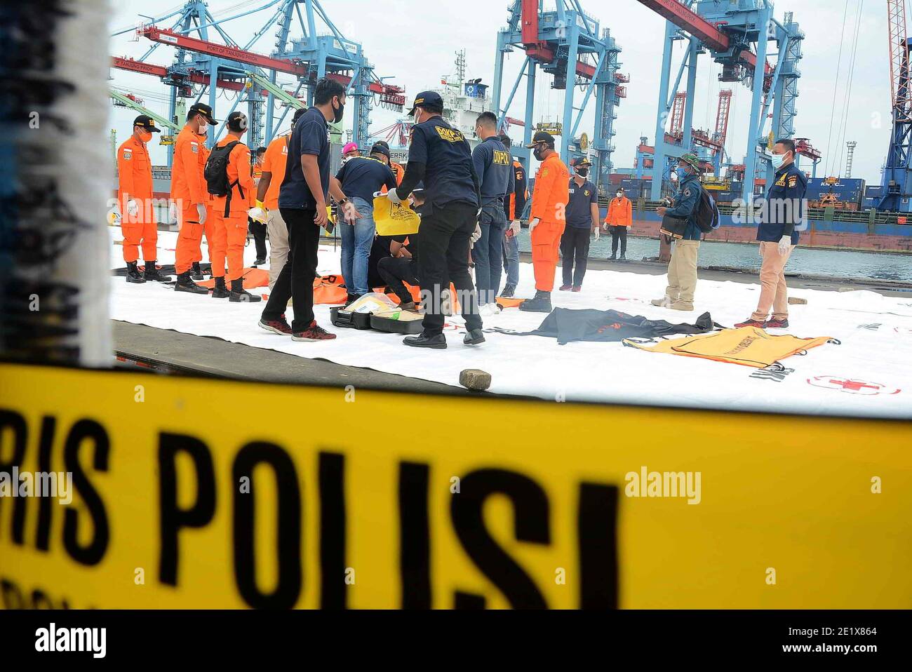 Indonesian Disaster Victim Identification (DVI) officers check remains including body parts recovered during the search operation of the wreckage of Sriwijaya Air plane SJ182, at Jakarta port, Indonesia, 10 January 2021. Remains of the aircraft along with human body found by search and rescue teams in the waters of the Thousand Islands. An Indonesian passenger aircraft with 62 people on board crashed into the sea after taking off from Jakarta, authorities said Saturday. The plane carried 50 passengers on board, including 10 children, plus 12 crew members. (Photo by Rahmat Dian Prasanto/INA P Stock Photo