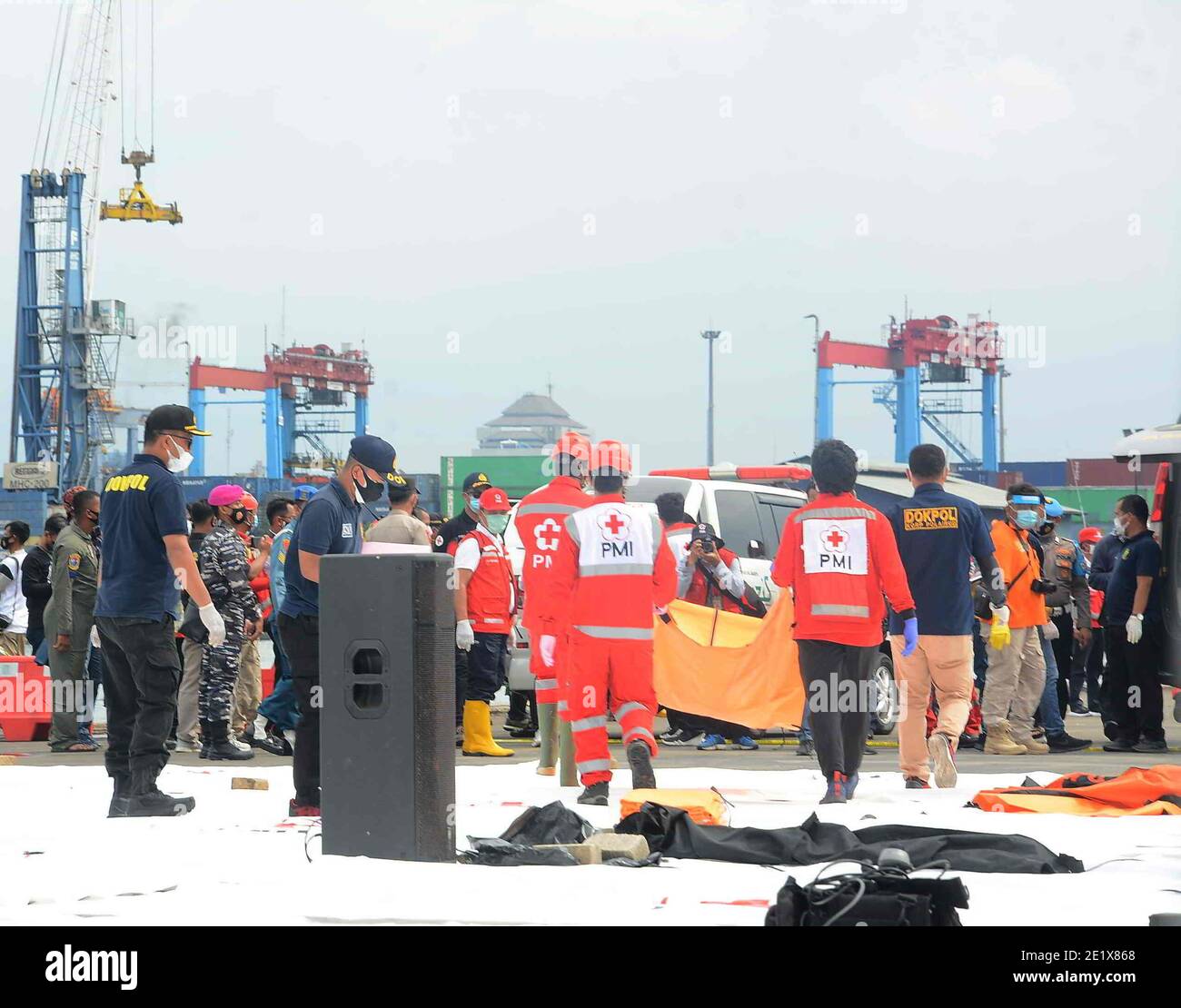 Indonesian Disaster Victim Identification (DVI) officers check remains including body parts recovered during the search operation of the wreckage of Sriwijaya Air plane SJ182, at Jakarta port, Indonesia, 10 January 2021. Remains of the aircraft along with human body found by search and rescue teams in the waters of the Thousand Islands. An Indonesian passenger aircraft with 62 people on board crashed into the sea after taking off from Jakarta, authorities said Saturday. The plane carried 50 passengers on board, including 10 children, plus 12 crew members. (Photo by Rahmat Dian Prasanto/INA P Stock Photo
