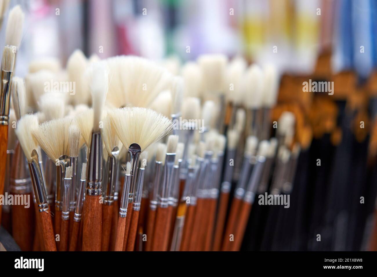 Group artistic paintbrushes for artist New paint brushes on shelf display in stationery shop. Art painting concept. Concept selling tools for artists Stock Photo