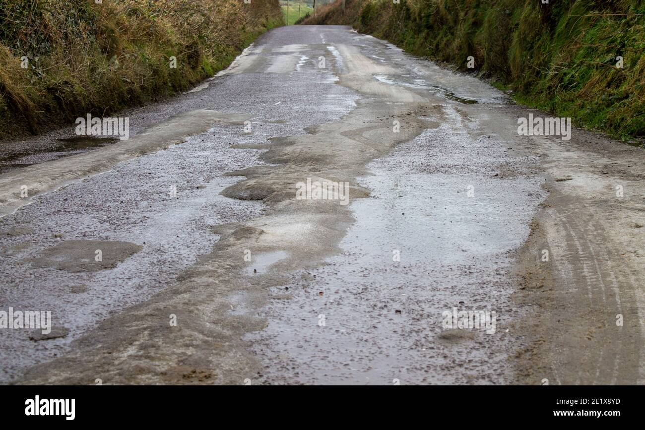 Frozen surface runoff on roads causing driving hazard Stock Photo - Alamy