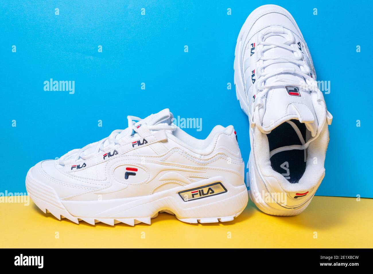 Tyumen, Russia-November 27, 2020: womens sneakers fila white on a  multi-colored blue yellow background Stock Photo - Alamy