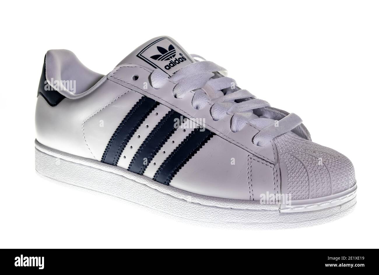 Norwich, Norfolk, UK – December 19 2020. An illustrative photo of a single  retro style white Adidas sneaker with blue stripes Stock Photo - Alamy