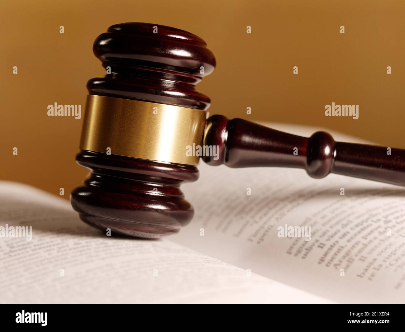 Opened juridical books with hammer on wooden table, law concept Stock Photo