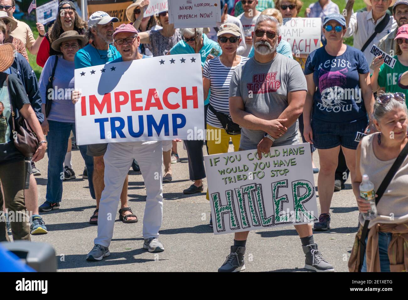 Boston, Massachusetts, US-June 15, 2019: Protesters hold signs reading 'Impeach Trump' Stock Photo