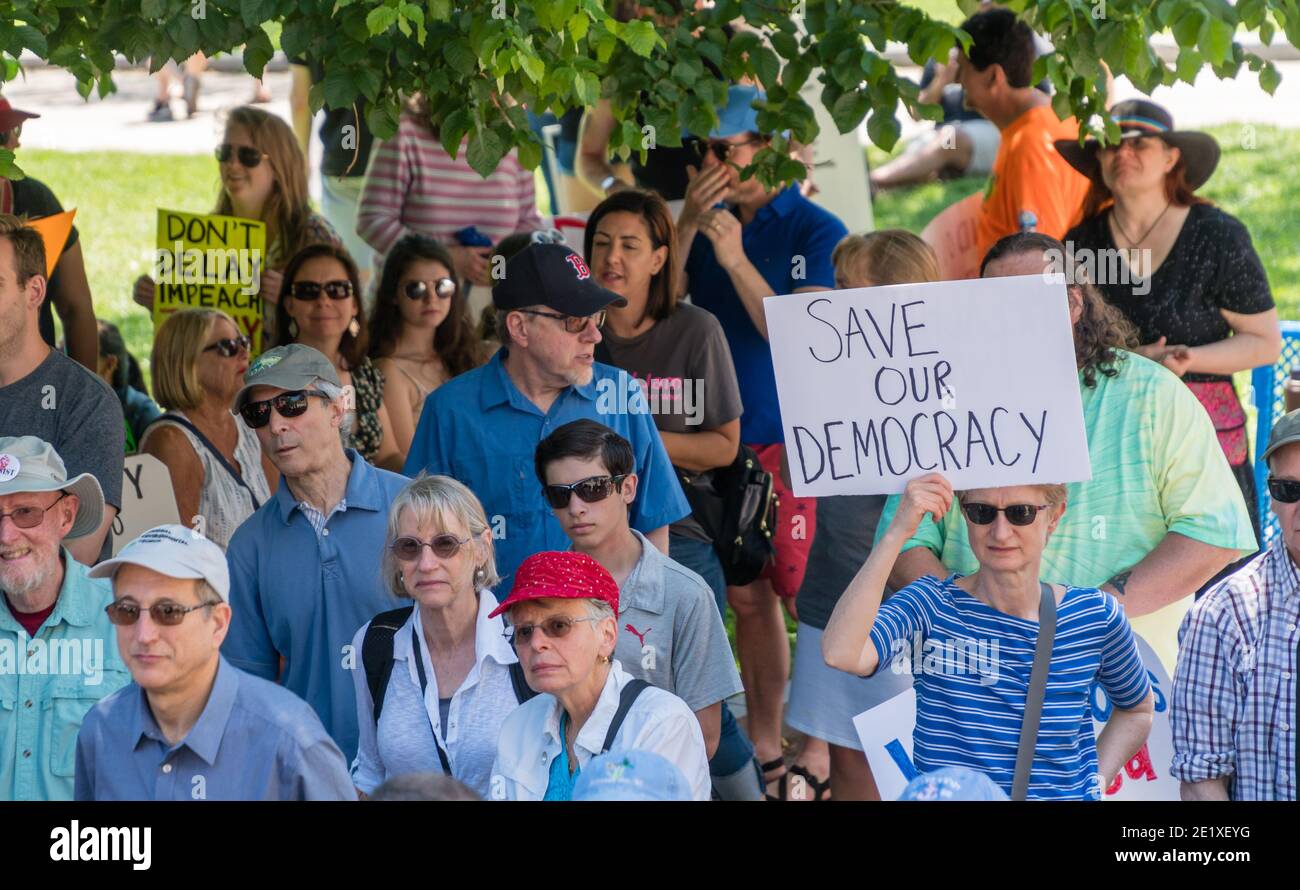 Boston, Massachusetts, US-June 15, 2019: Protesters hold signs reading 'Impeach Trump' Stock Photo