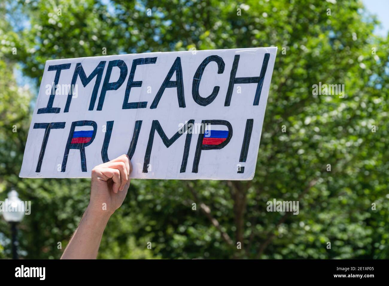 Boston, Massachusetts, US-June 15, 2019: Protesters hold signs reading 'Impeach Trump' Stock Photo