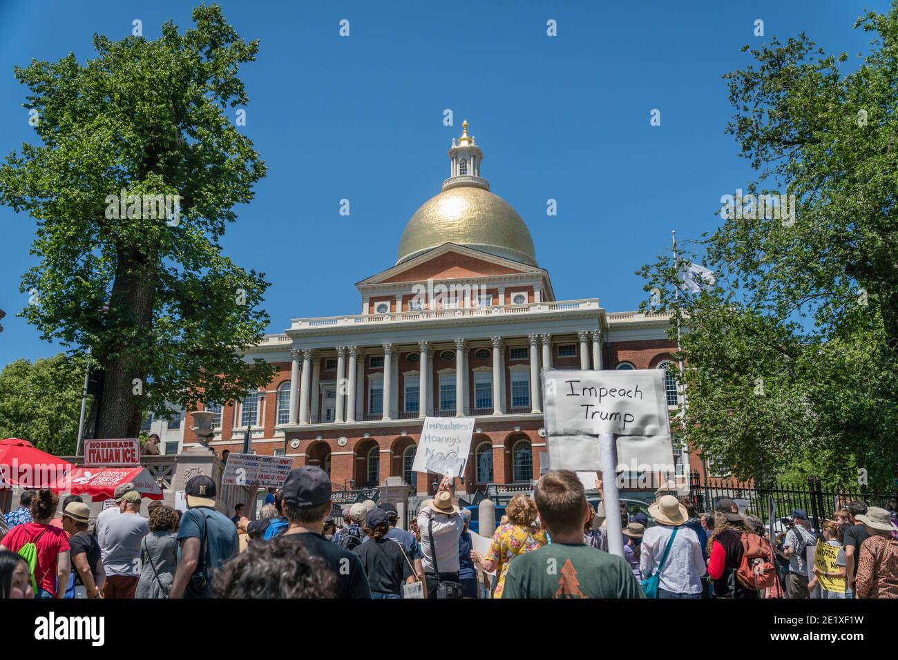 Boston, Massachusetts, US-June 15, 2019: Protesters hold signs reading 'Impeach Trump' Stock Photo