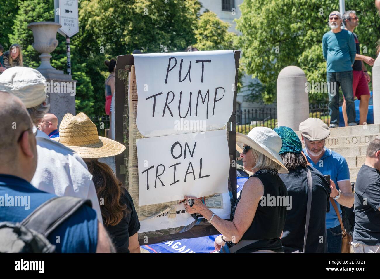 Boston, Massachusetts, US-June 15, 2019: Protesters hold signs reading 'Impeach Trump' Stock Photo