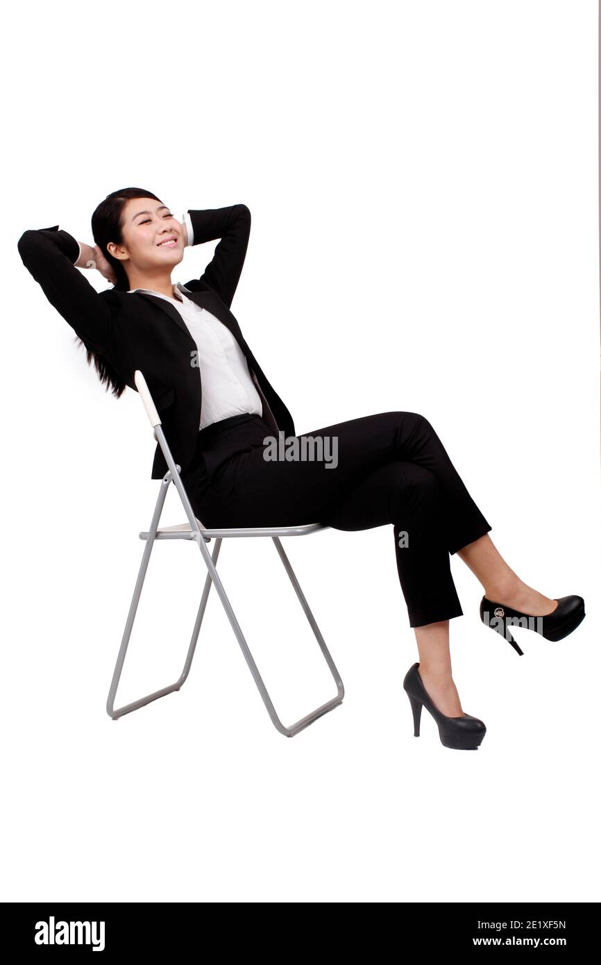 Woman sitting on chair eyes closed hi-res stock photography and images ...