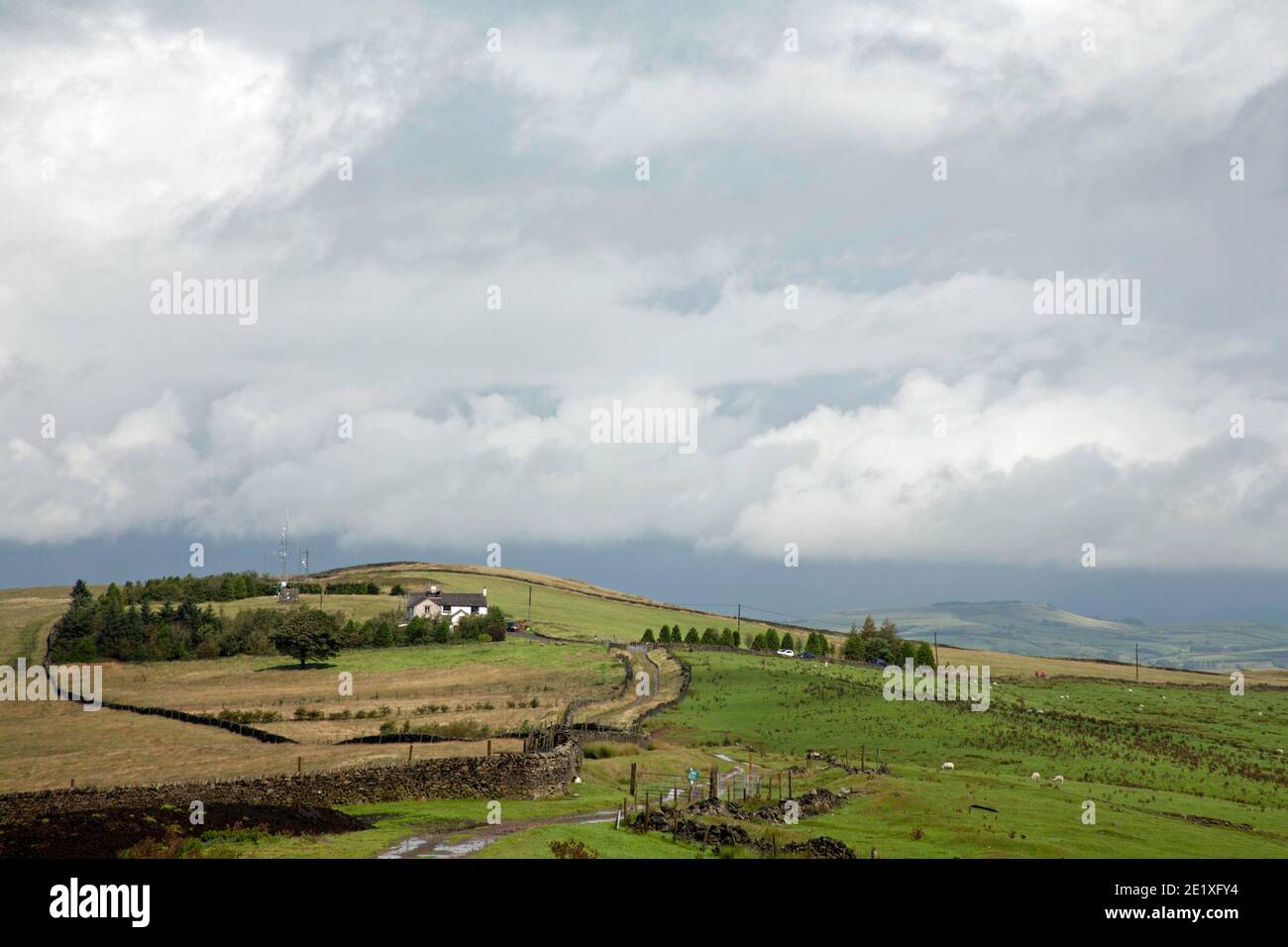 Storm clouds passing over Bowstonegate Lyme Handley Lyme Park viewed from Sponds Hill Cheshire England Stock Photo
