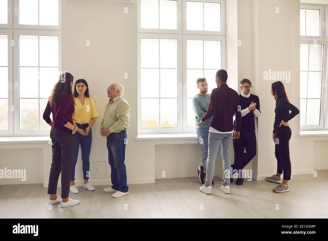Diverse people meeting, getting to know each other and discussing problems together Stock Photo