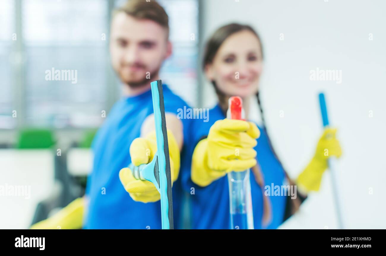 Commercial cleaner team, focus on the gear Stock Photo Alamy