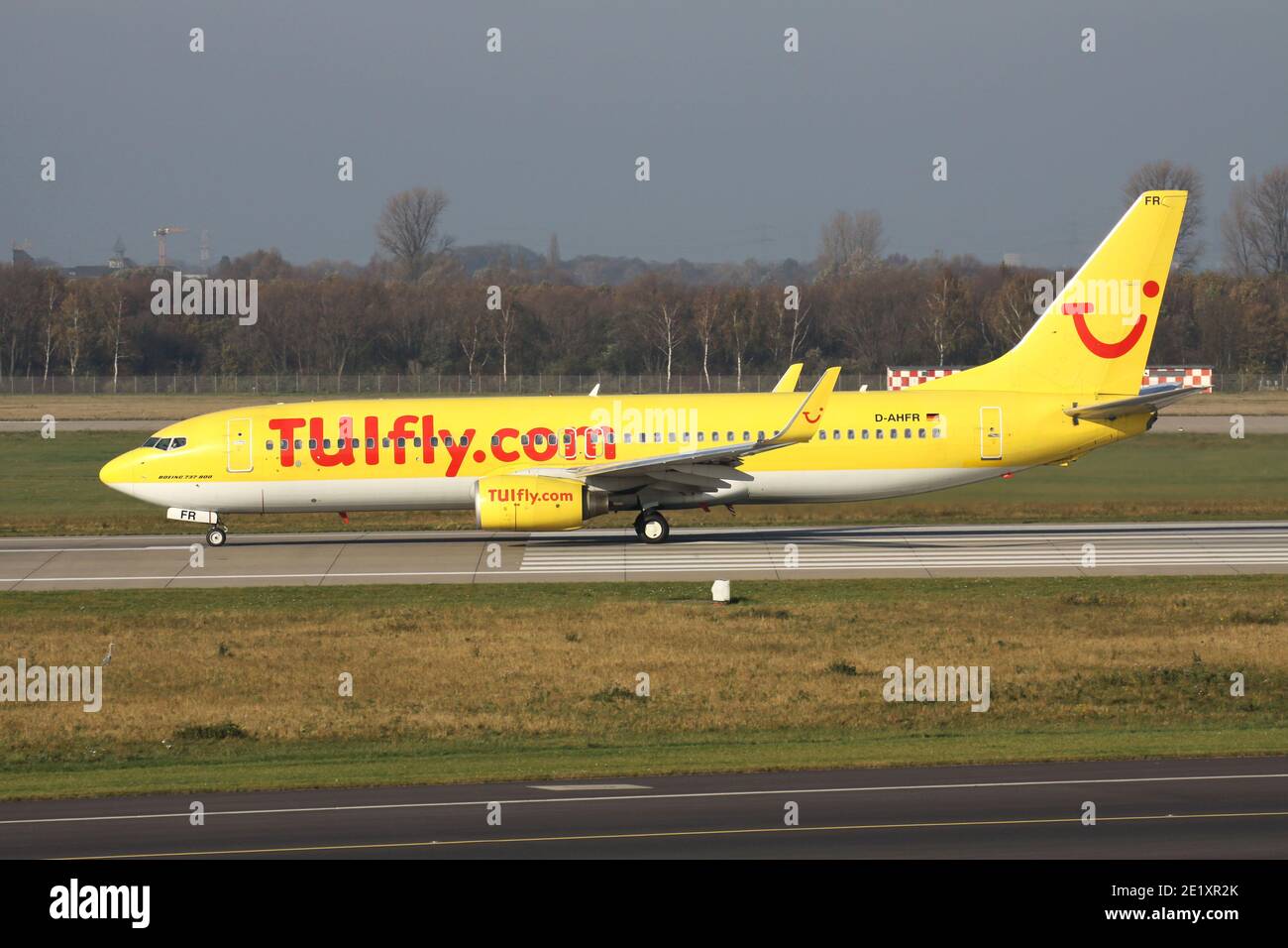 German TUIfly Boeing 737-800 with registration D-AHFR on take off roll on runway 23L of Dusseldorf Airport. Stock Photo