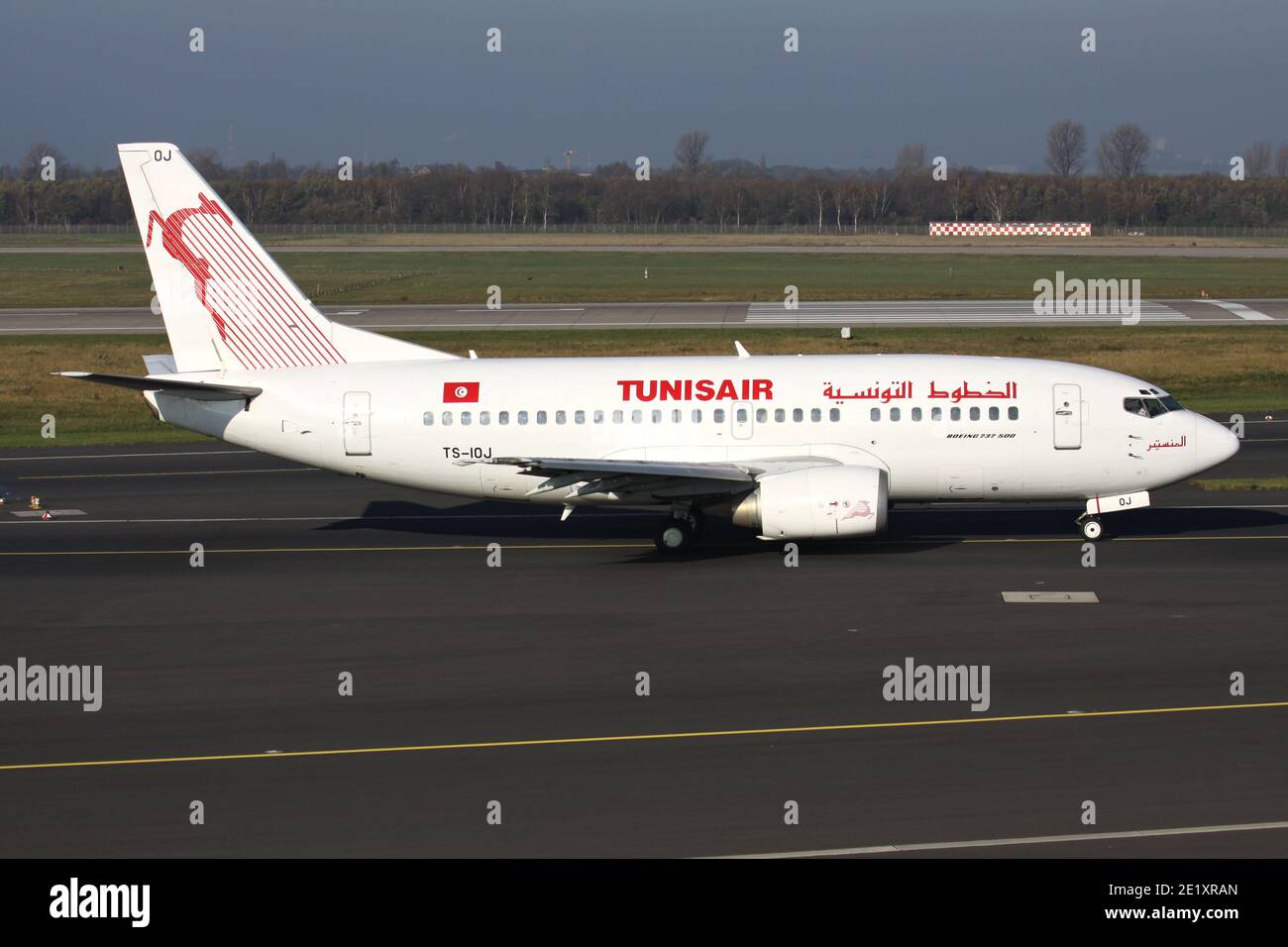 Tunisair Boeing 737-500 with registration TS-IOJ on taxiway at Dusseldorf Airport. Stock Photo