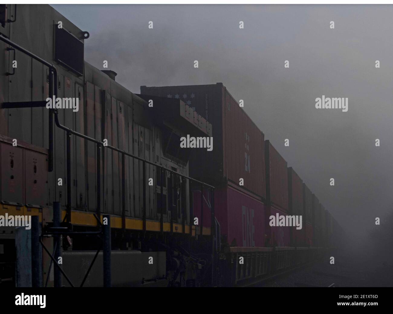Freight train in the fog Stock Photo