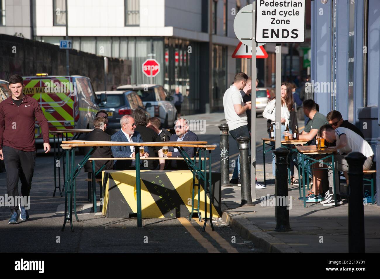Liverpool, UK - September 19 2020: People in Liverpool enjoy a drink in the sun before local lockdown restrictions come into effect on Tuesday. Stock Photo