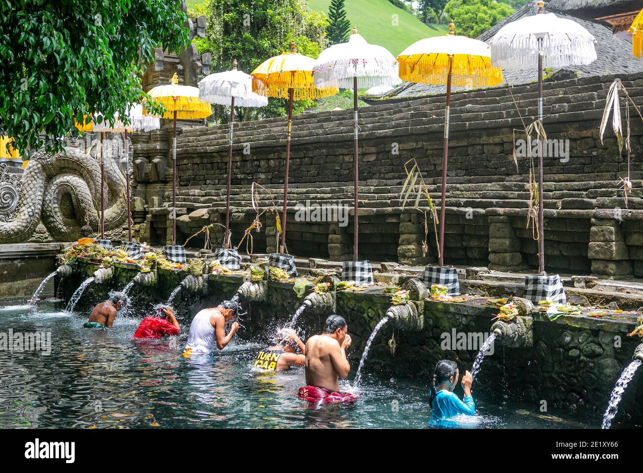 Refreshment in a sacred spring in Bali Island of Indonesia… Stock Photo