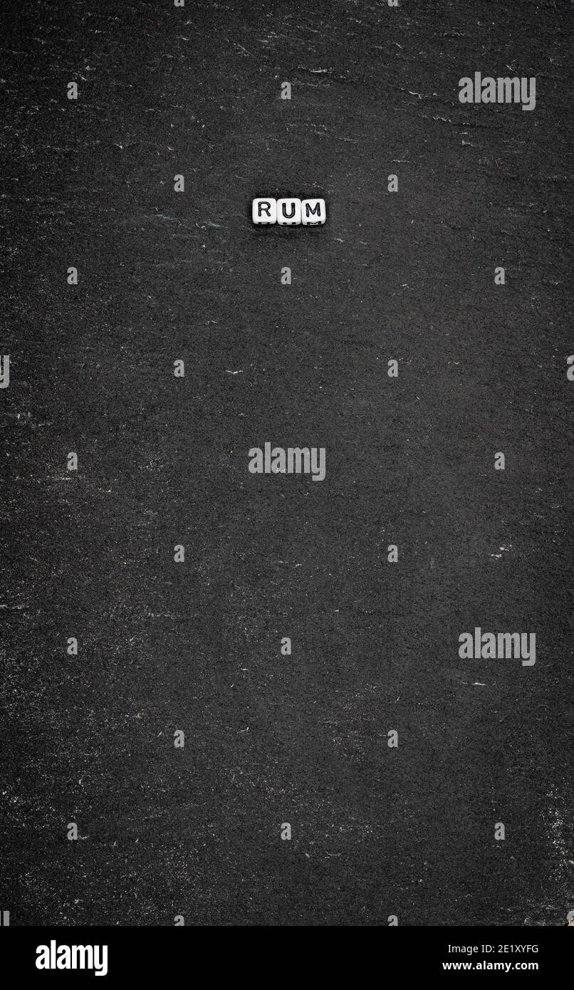 Word rum on black stone background Stock Photo Alamy