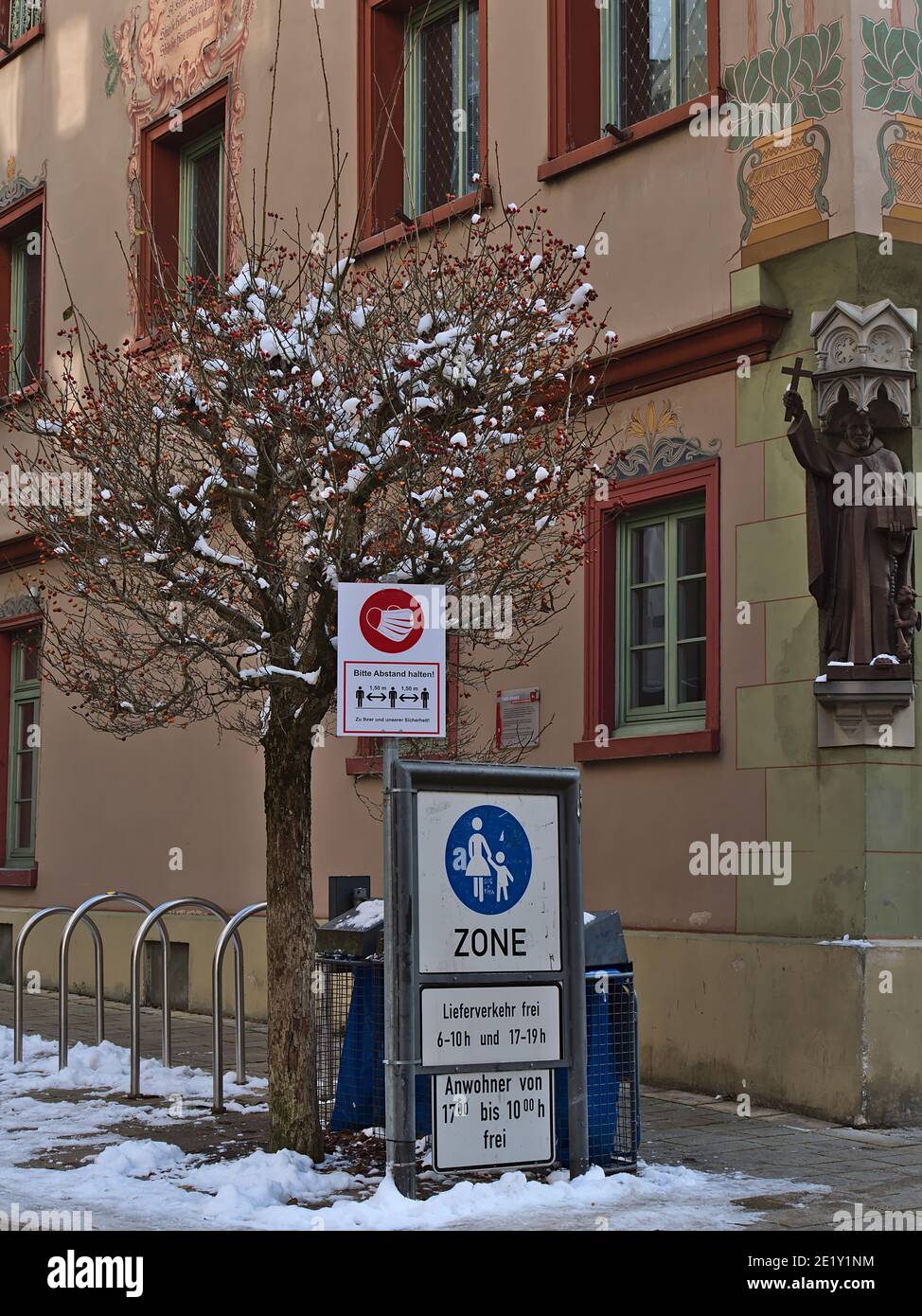 Sigmaringen, Germany - 01-09-2021: Entrance of pedestrian zone with signs. Upper sign: Obligation of face mask and social distancing due to Covid-19. Stock Photo