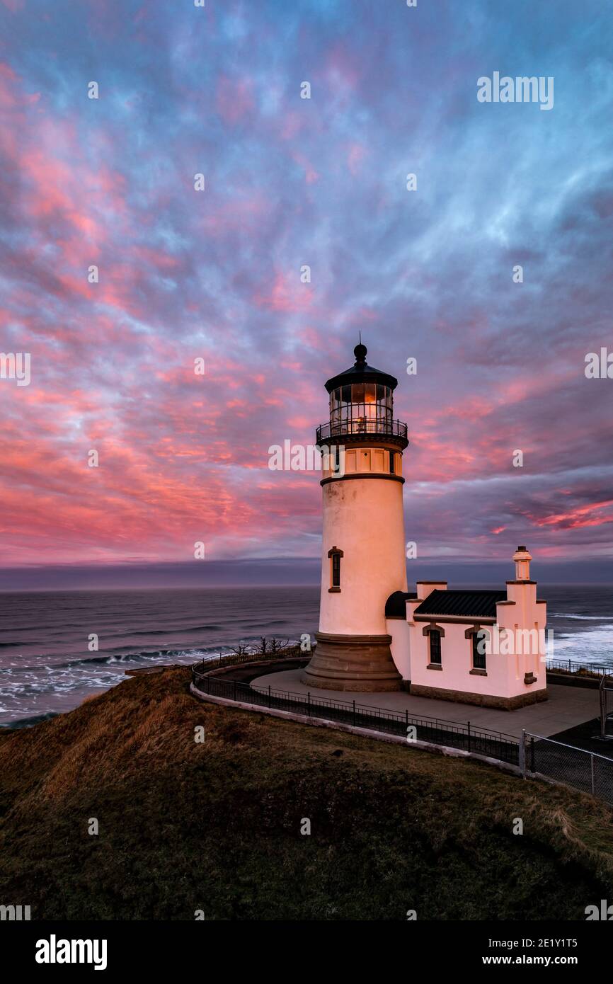 WA20020-00.....WASHINGTON - Sunrise with North Head Lighthouse in Cape Disappointment State Park. Stock Photo