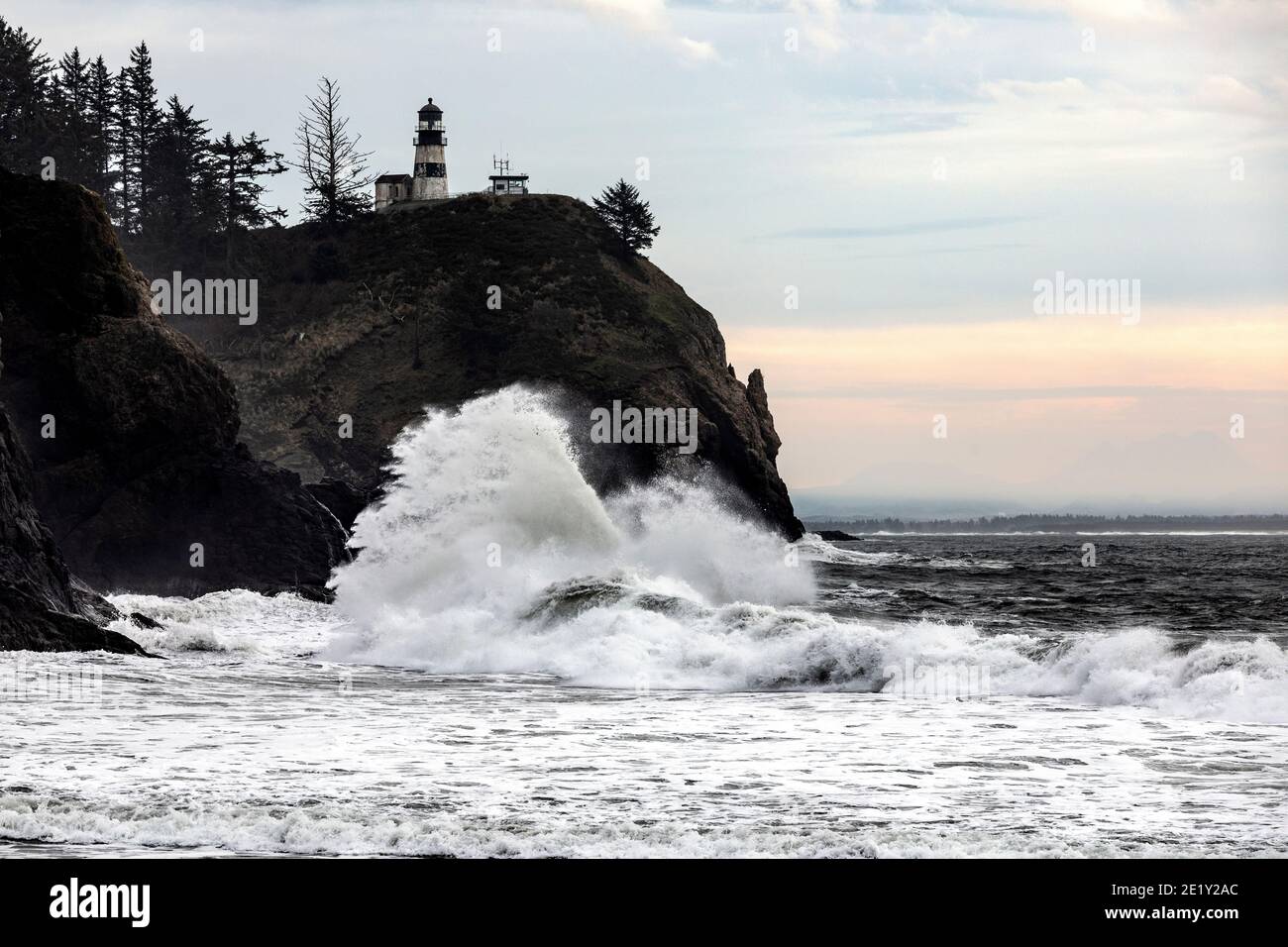 WA20028-00.....WASHIHGTON - Crashing surf at Cape Disappointment Lighthouse near the outflow of the Columbia River in Cape Disappointment State Park. Stock Photo