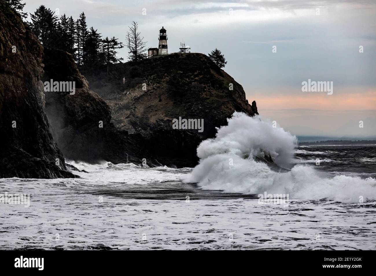 WA20031-00.....WASHIHGTON - Crashing surf at Cape Disappointment Lighthouse near the outflow of the Columbia River in Cape Disappointment State Park. Stock Photo
