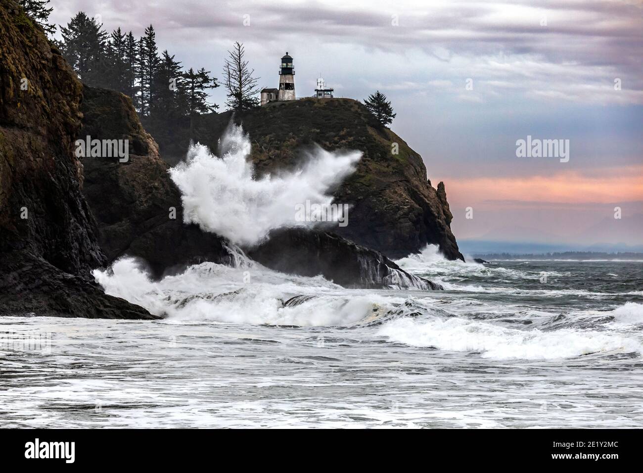 WA20033-00.....WASHIHGTON - Crashing surf at Cape Disappointment Lighthouse near the outflow of the Columbia River in Cape Disappointment State Park. Stock Photo
