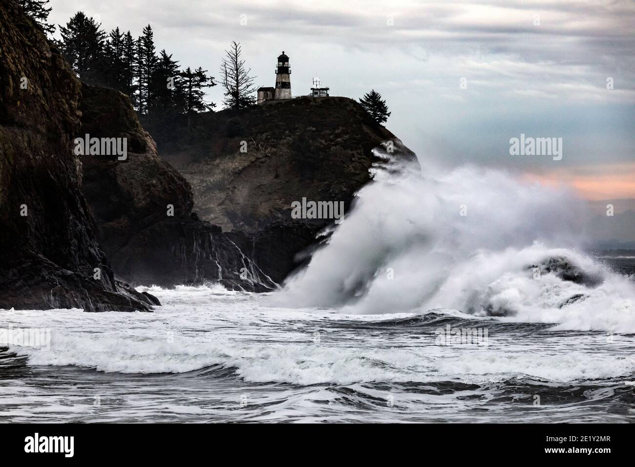 WA20034-00.....WASHIHGTON - Crashing surf at Cape Disappointment Lighthouse near the outflow of the Columbia River in Cape Disappointment State Park. Stock Photo