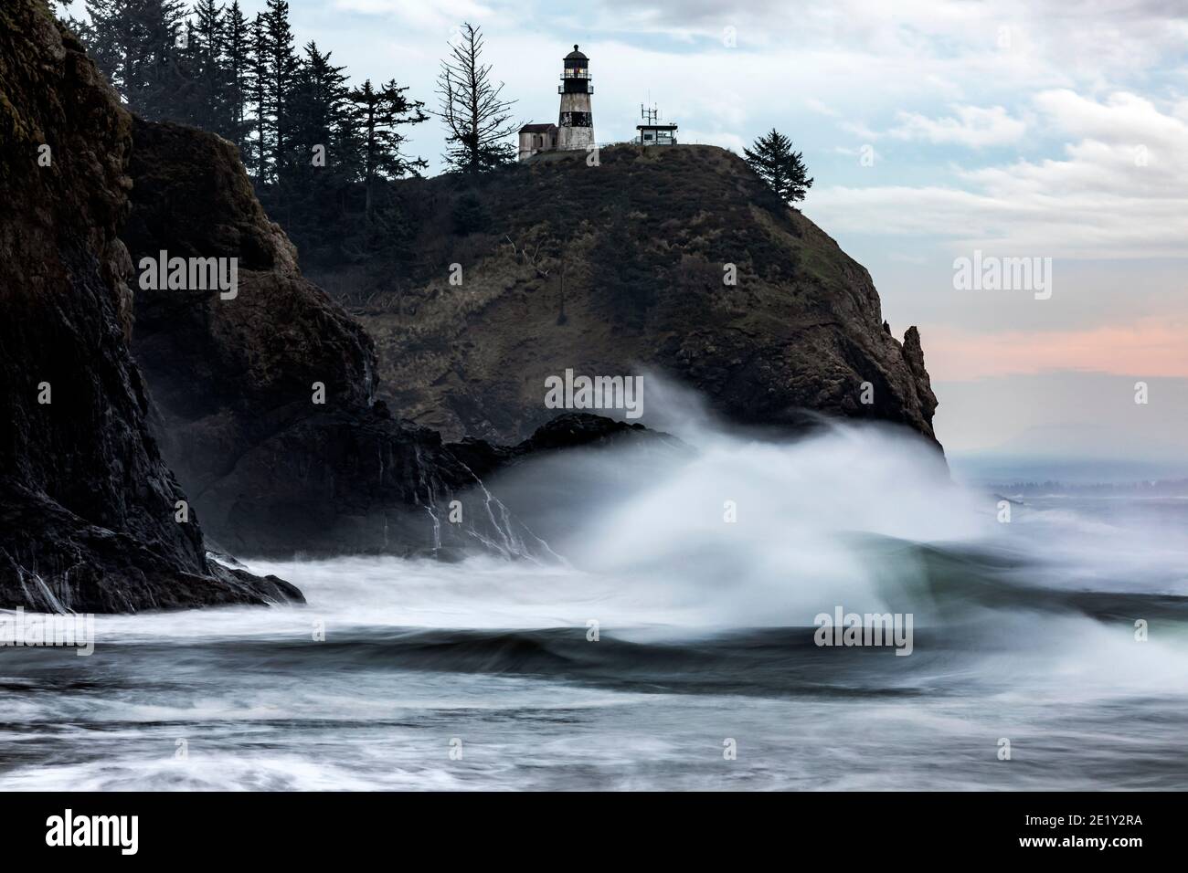 WA20035-00.....WASHIHGTON - Crashing surf at Cape Disappointment Lighthouse near the outflow of the Columbia River in Cape Disappointment State Park. Stock Photo