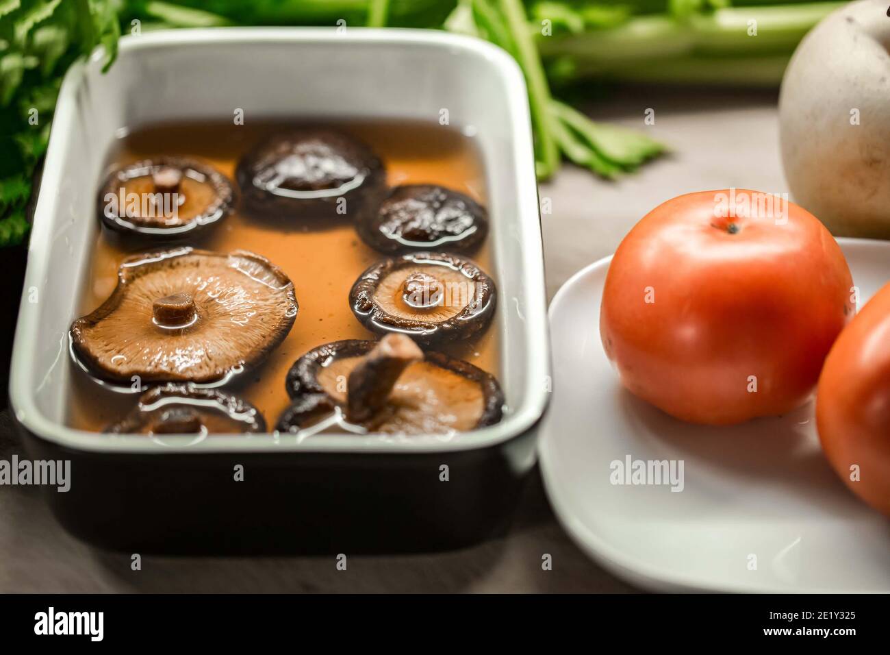 Dried shiitake mushroom in transparent bowl with water Stock Photo Alamy