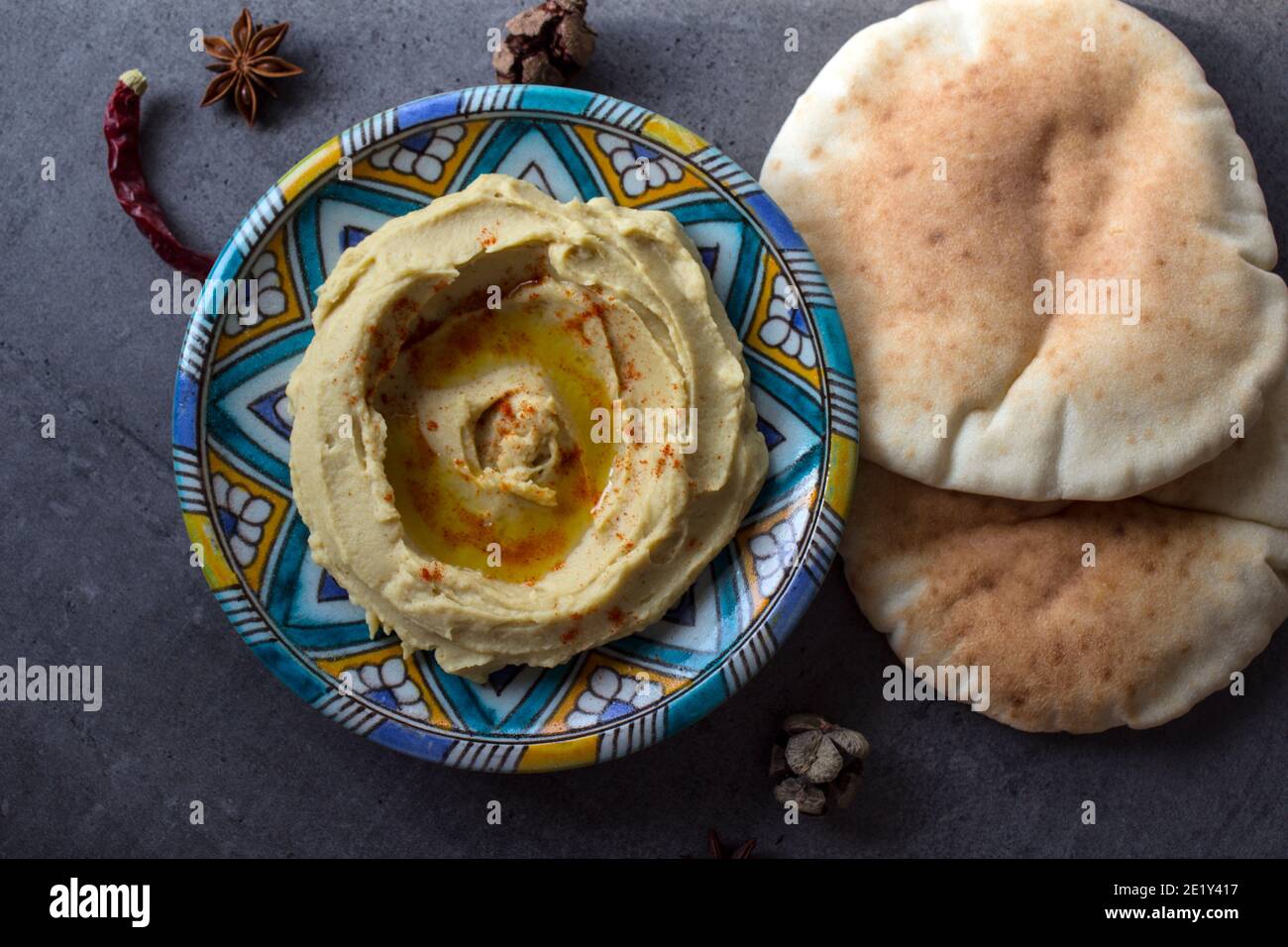 Hummus with pita bread. Classic israeli hummus close up photo. Balanced