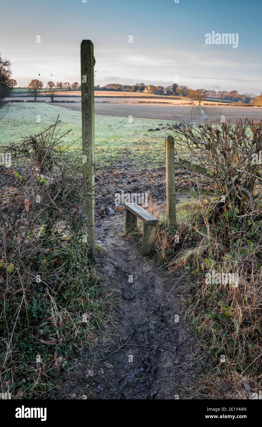 Wooden post showing a public footpath over a field towards Ault Hucknall, Derbyshire, Stock Photo