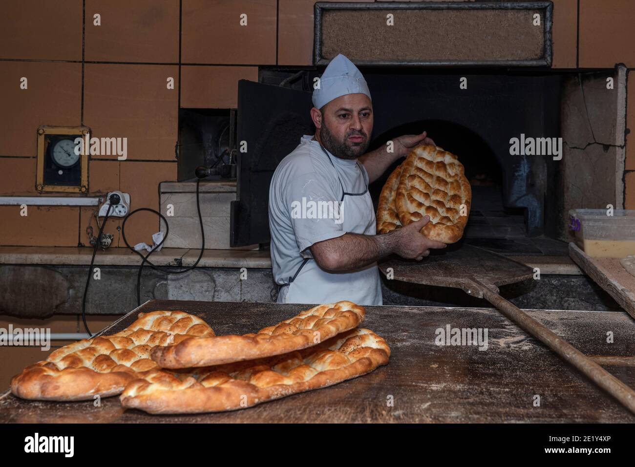 Pita bread in oven Stock Photo - Alamy