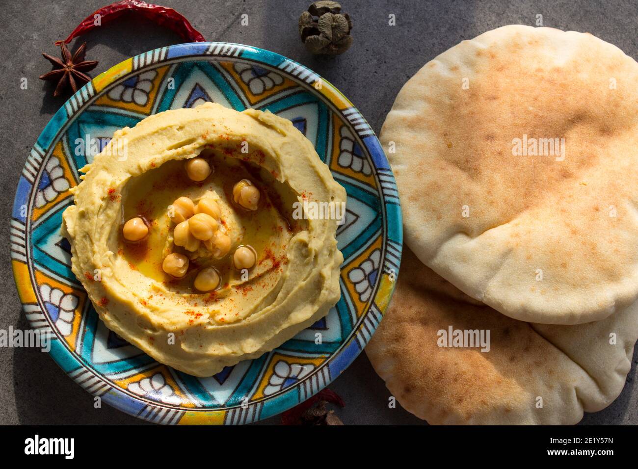 Hummus with pita bread. Classic israeli hummus close up photo. Balanced
