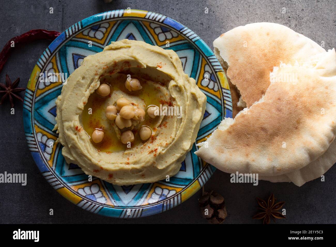 Hummus with pita bread. Classic israeli hummus close up photo. Balanced