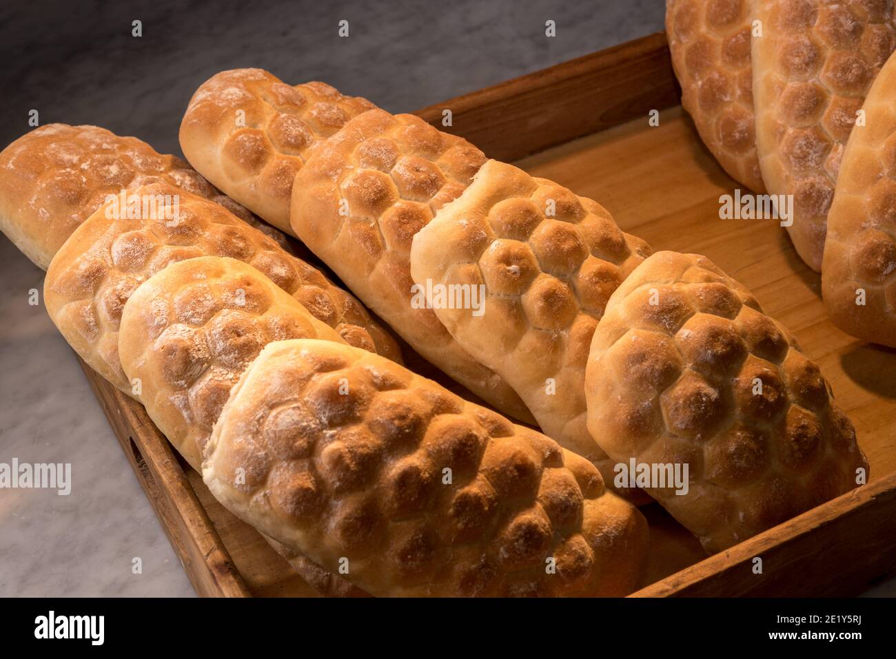 Italian bread, turtle shaped loaves in wodden tray Stock Photo