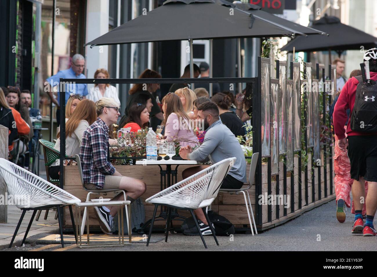 Liverpool, UK - September 19 2020: People eat outside in Liverpool city centre before local lockdown restrictions come into effect on Tuesday. Stock Photo