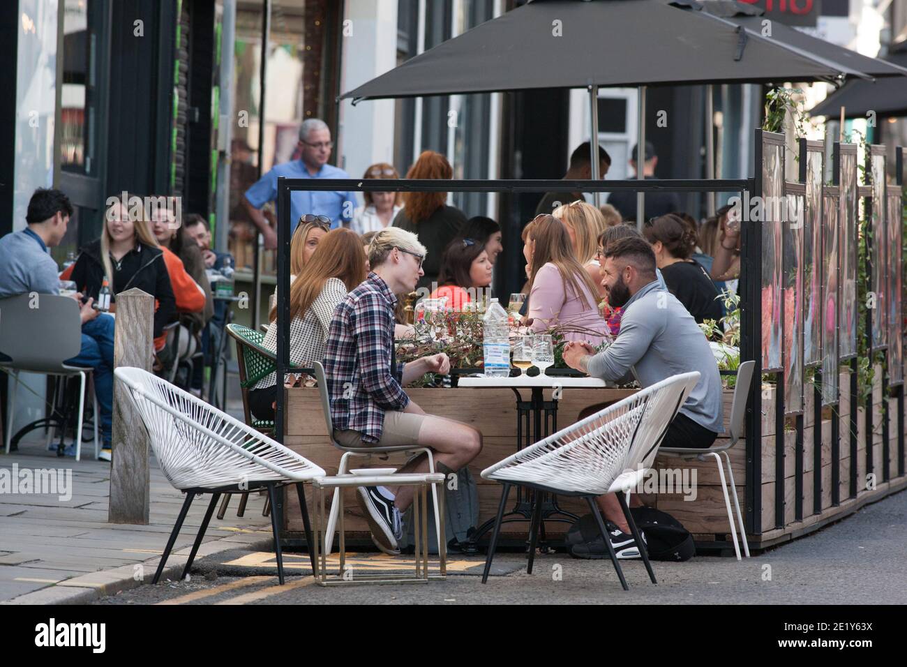 Liverpool, UK - September 19 2020: People eat outside in Liverpool city centre before local lockdown restrictions come into effect on Tuesday. Stock Photo