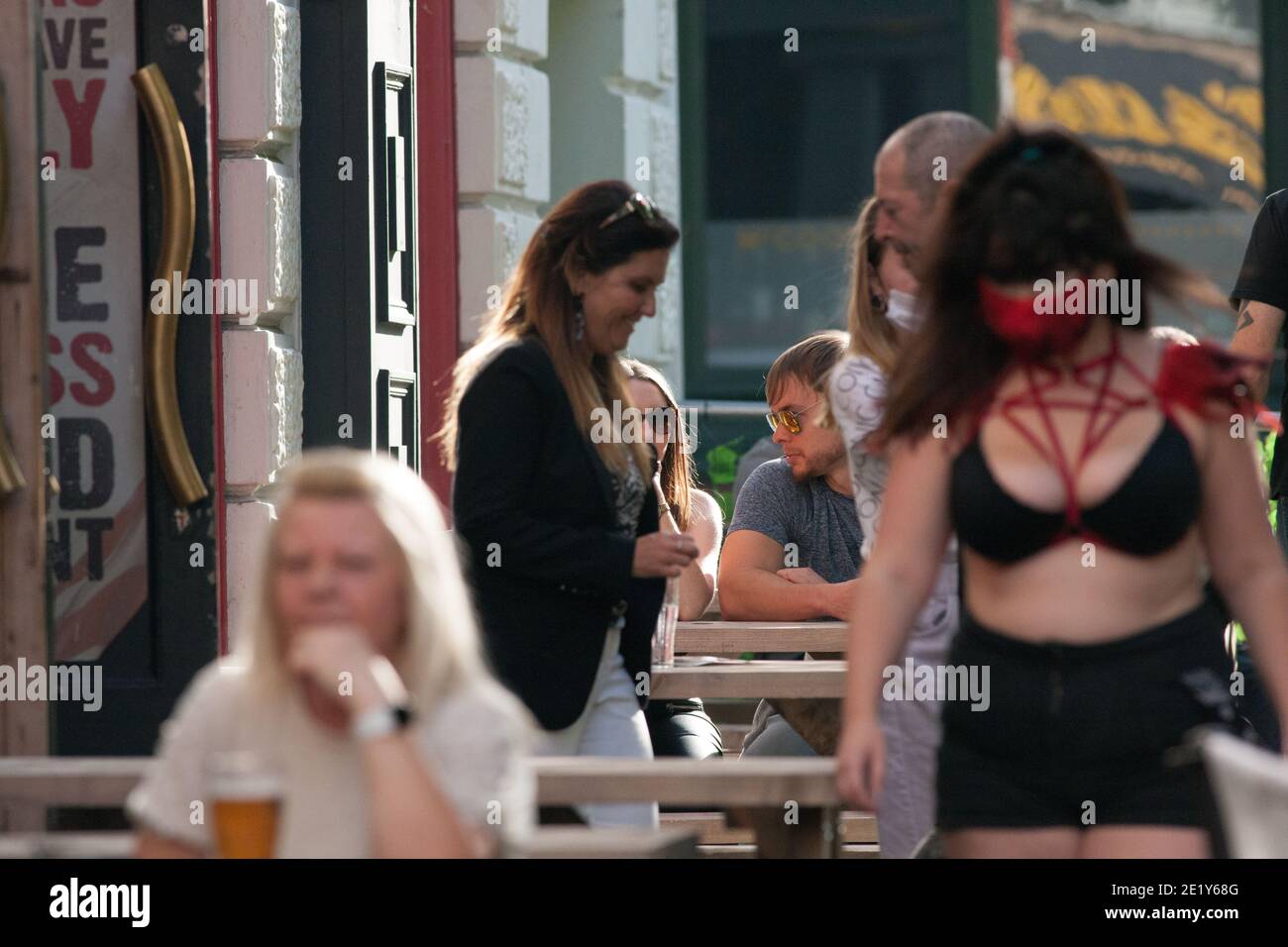 Liverpool, UK - September 19 2020: People in Liverpool enjoy a drink in the sun before local lockdown restrictions come into effect on Tuesday. Stock Photo