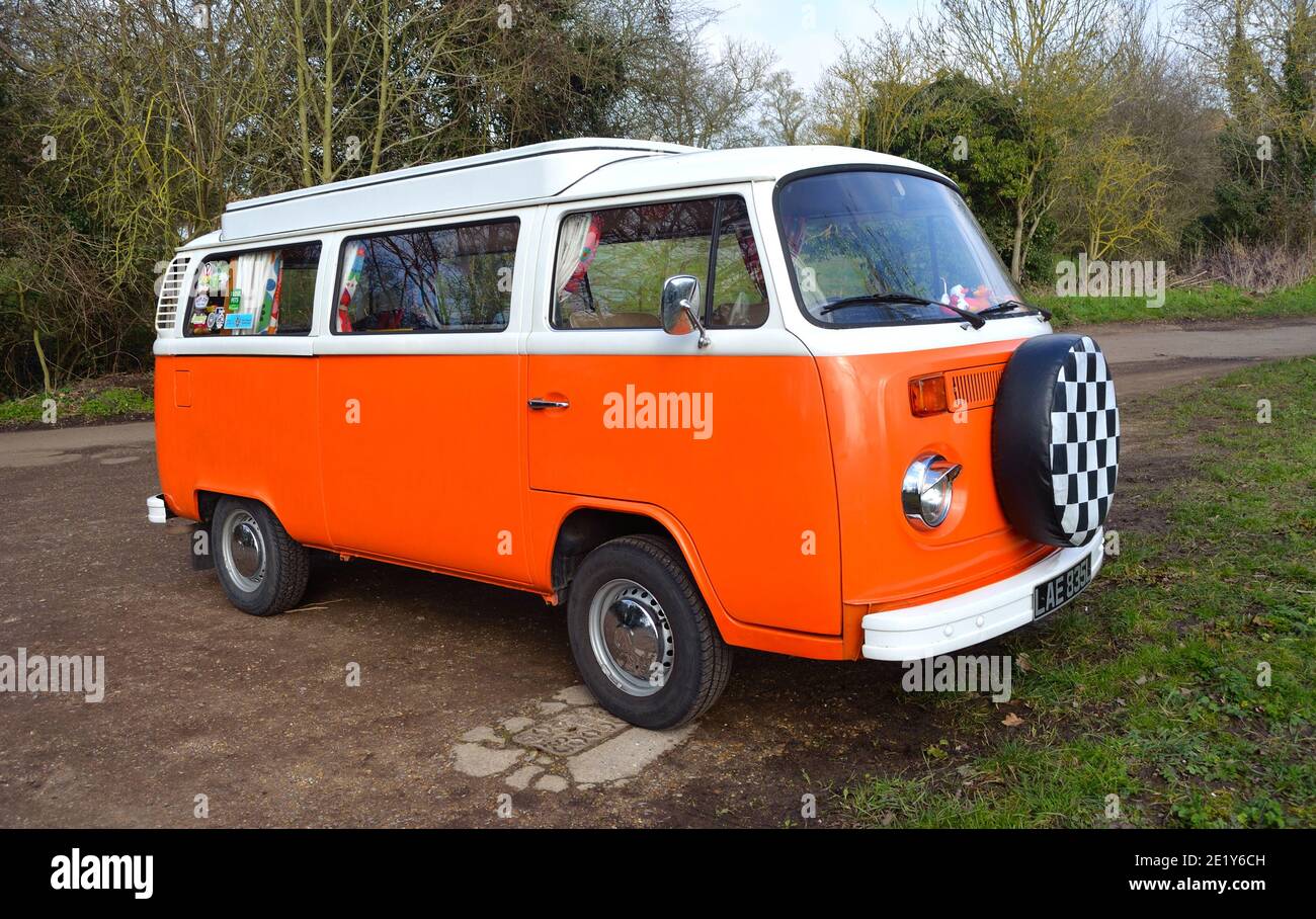 Classic Volkswagen Camper Van in White and Orange. Stock Photo