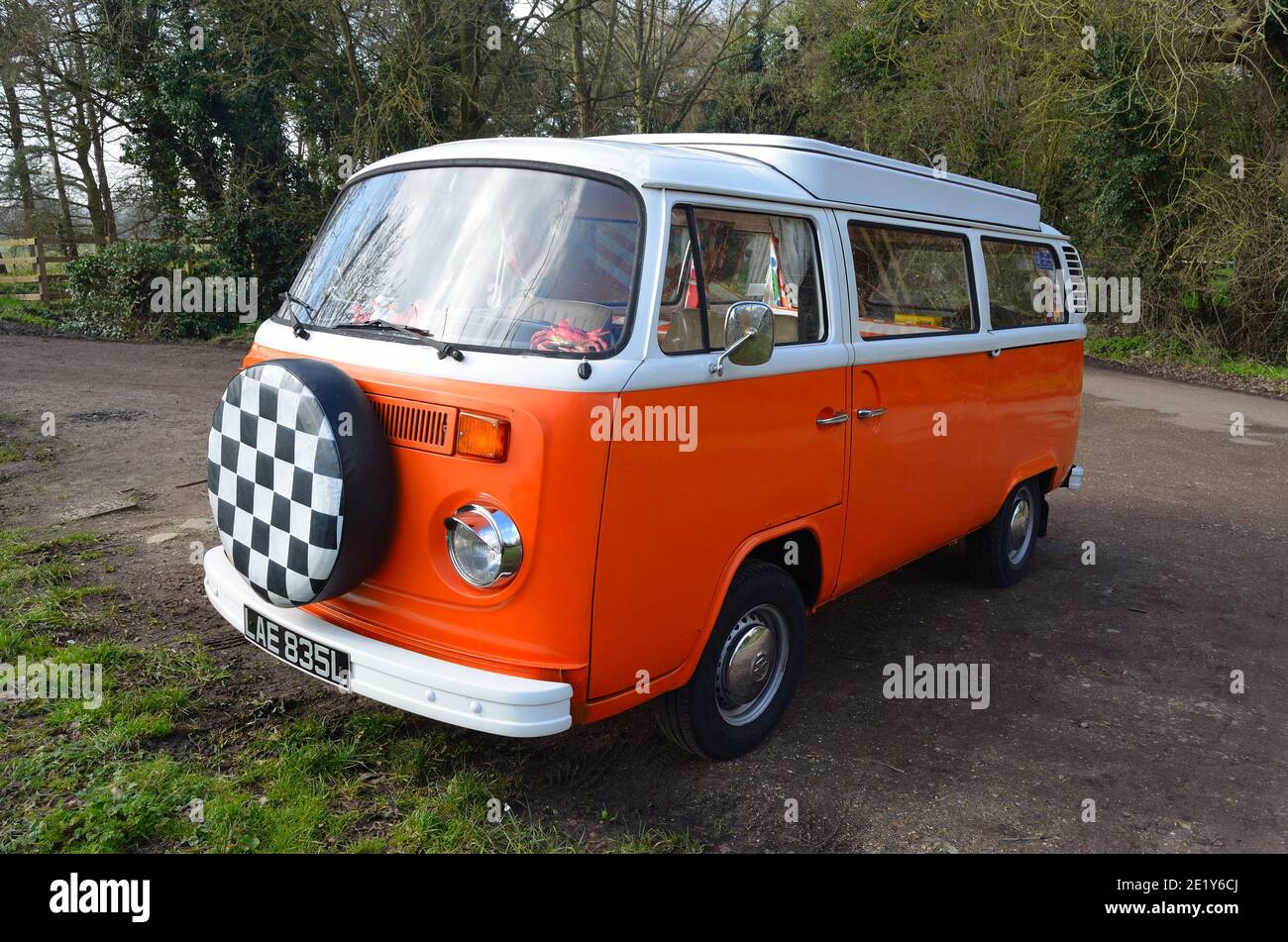 Classic Volkswagen Camper Van in White and Orange. Stock Photo