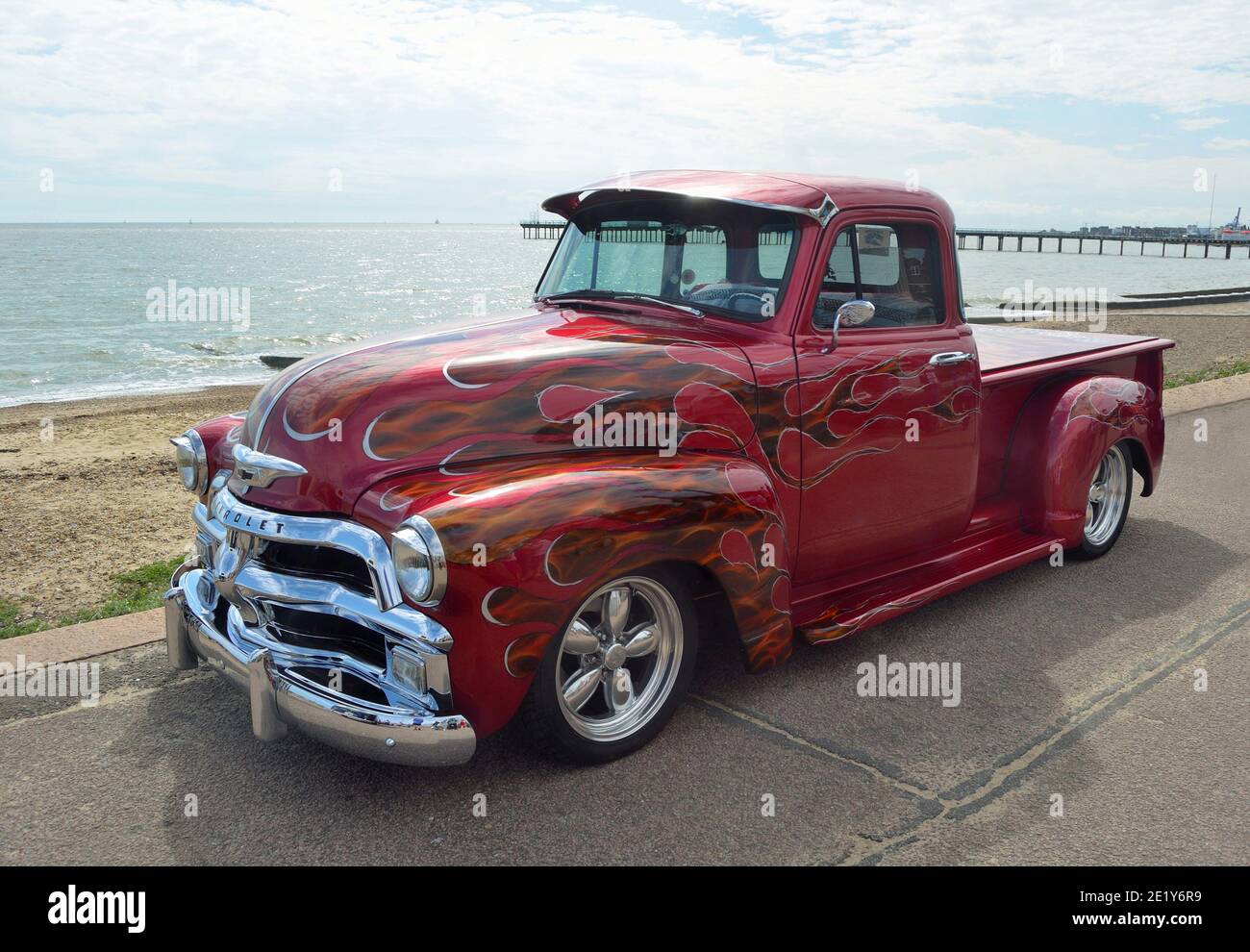 Classic red Chevrolet pickup truck on Felixstowe seafront. Stock Photo